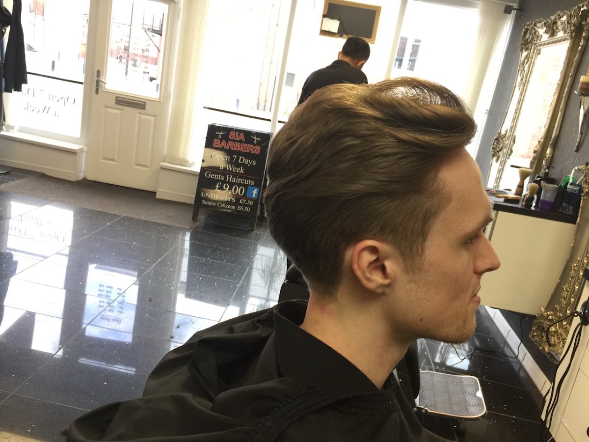A finished cut, styled and swept back