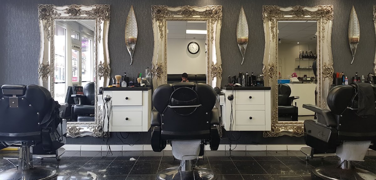 Inside SIA Barbers, the mirrors and chairs down one wall