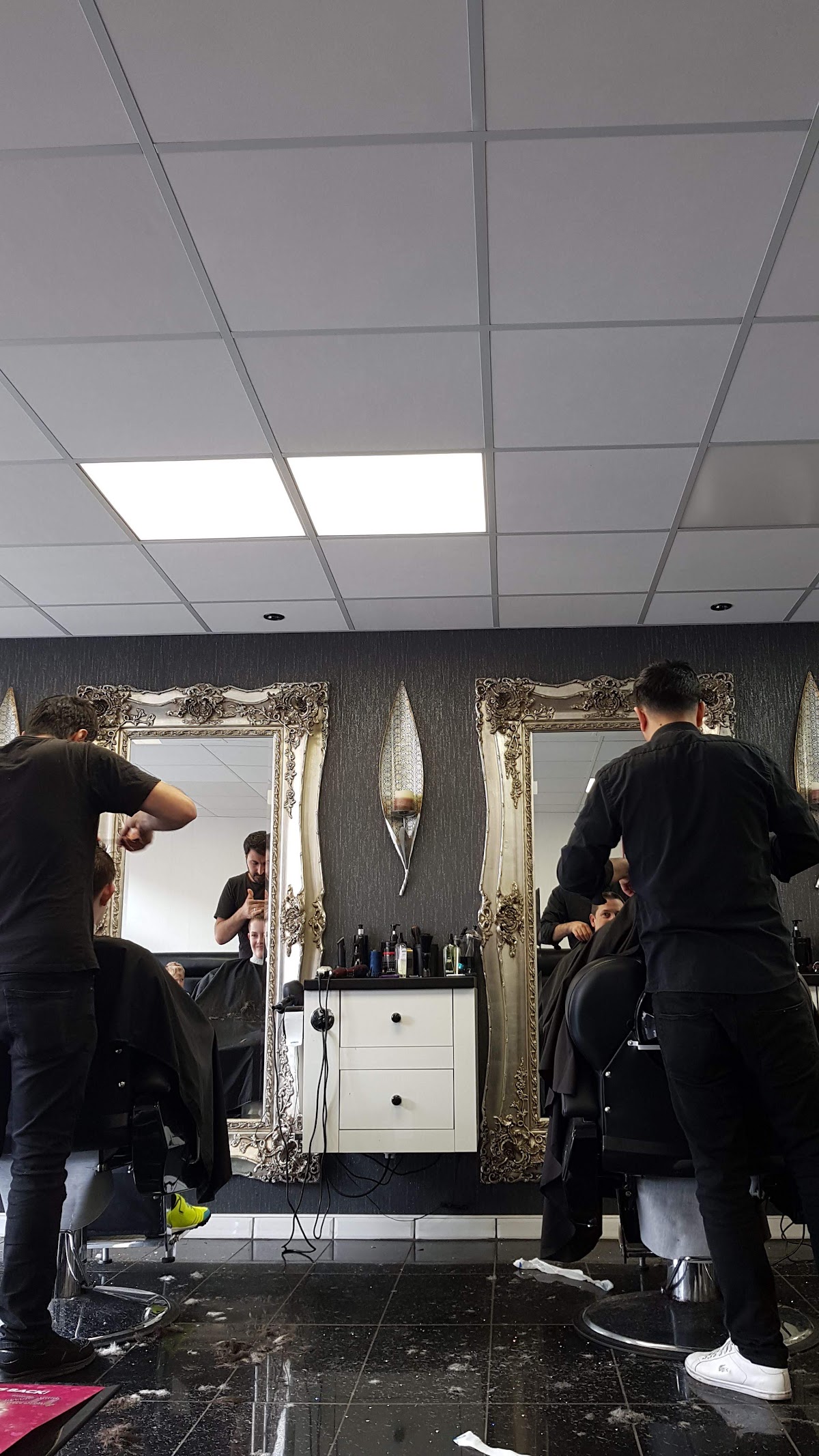 Barbers at work on a busy afternoon